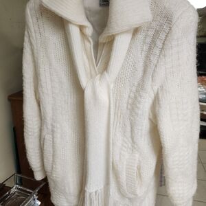 Women's sweater coat with attached  scarf.